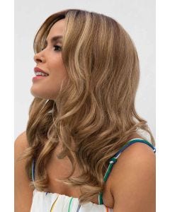 Woman in an extra long light auburn curly lace front wig