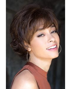 Woman in short brown straight wig with layers and bangs