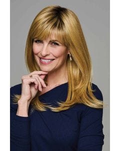 Woman wearing long layered blonde wig with side-swept bangs and smooth, shoulder-length ends