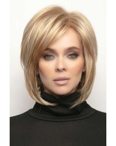 Woman in blonde short bob wig with longer layers in front and bangs