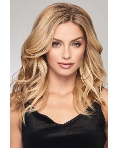Woman in a 16" curly warm blonde hair topper for thinning hair