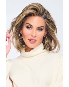 Woman in a shoulder length light brown lace front blunt bob wig