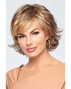 Woman in a short medium brown lace front wig with feathered layers