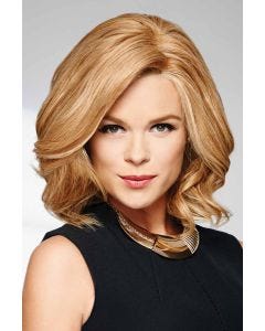 Woman in a light auburn, curly, shoulder length bob wig