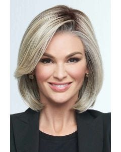 Woman in a chin length light blonde lace front bob wig with long side bangs