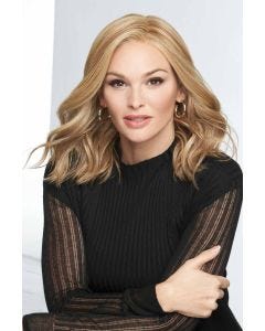 Woman in a past the shoulders curly warm blonde lace front wig