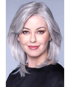 Woman in a shoulder length straight silver lace front wig
