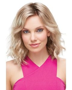 Woman in a large shoulder length curly blonde lace front wig