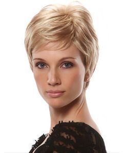 Woman in short blonde pixie wig with bangs and layers