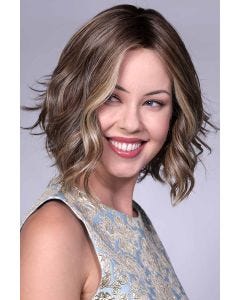Woman in short wavy bob wig by Bell Tress in dirty blonde