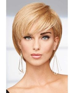 Woman in a long reddish blonde pixie wig with side bangs