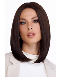 Woman in a past the shoulders platinum blonde lace front wig with long layers
