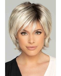 Woman in a short shaggy platinum bob lace front wig with wispy bangs