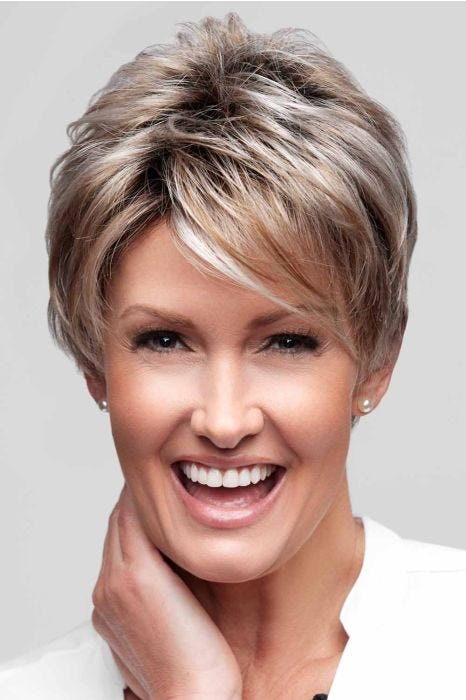 Woman in a long ash blonde lace front pixie wig