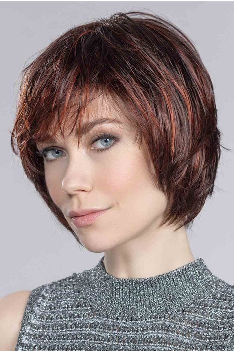 Woman in a chin length platinum blonde rounded bob wig