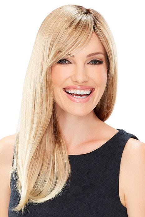 Woman in an extra long light blonde wig with long fringe bangs