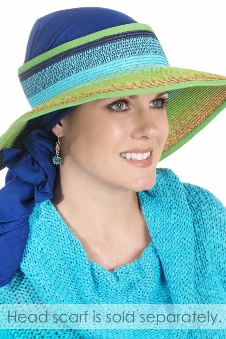 Woman in vibrant colors women's sun visor in blue and green with head scarf underneath