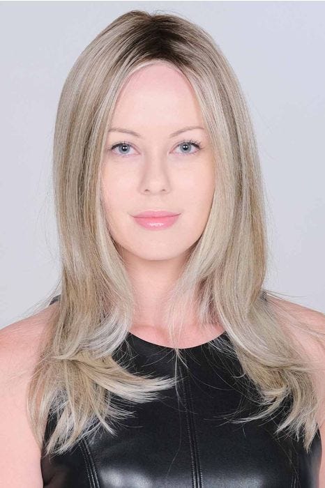 Woman in an extra long ash blonde lace front wig with long layers