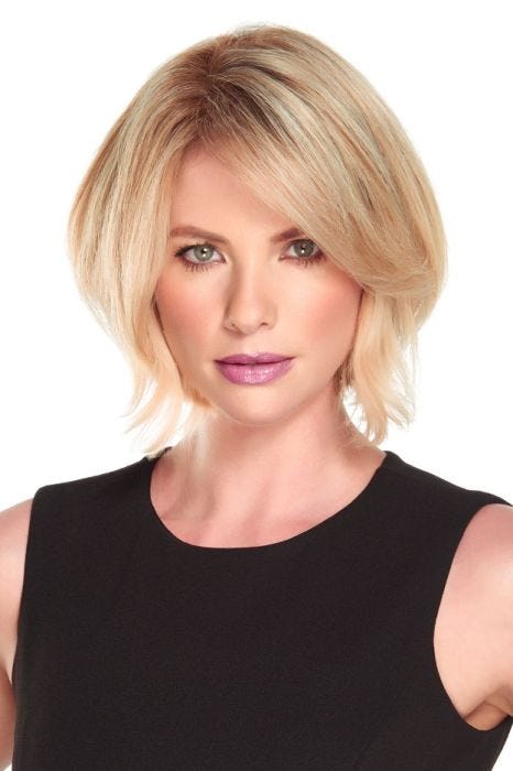 Woman in an 8" warm light blonde heat resistant hair topper with an extra large base