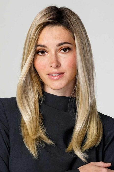 Woman in an 18" straight light blonde heat resistant wiglet hair topper for thinning hair