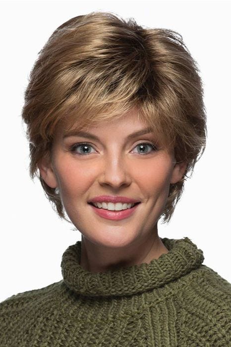 Woman in a short warm blonde layered wig with side bangs