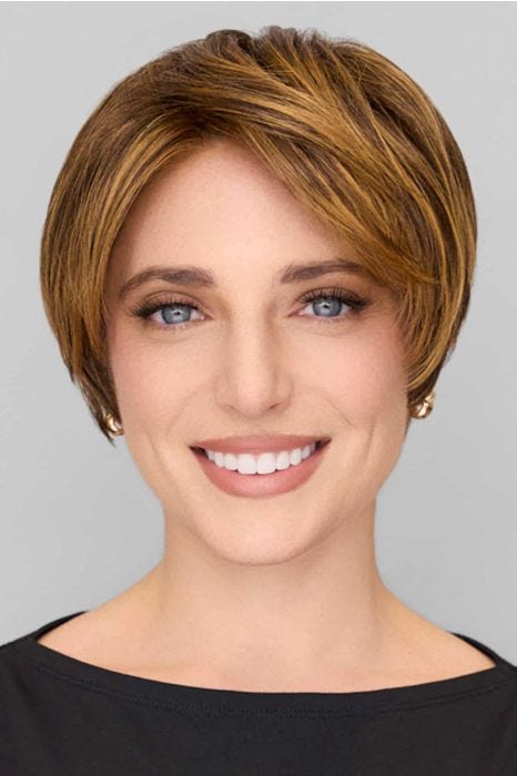 Woman in a long dark auburn pixie wig with side bangs