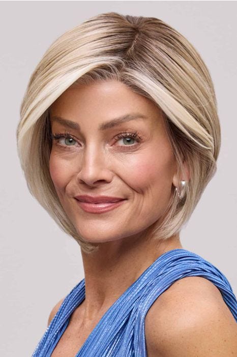 Woman in a chin length curly blonde angled lace front bob wig