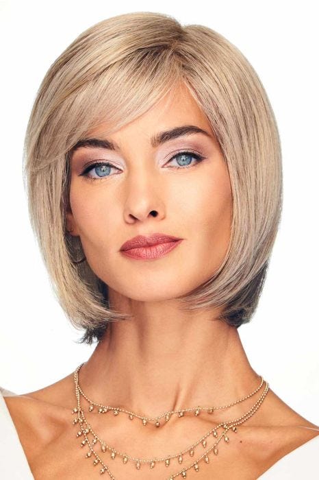 Woman in straight, shoulder length light brown bob lace front wig with bangs