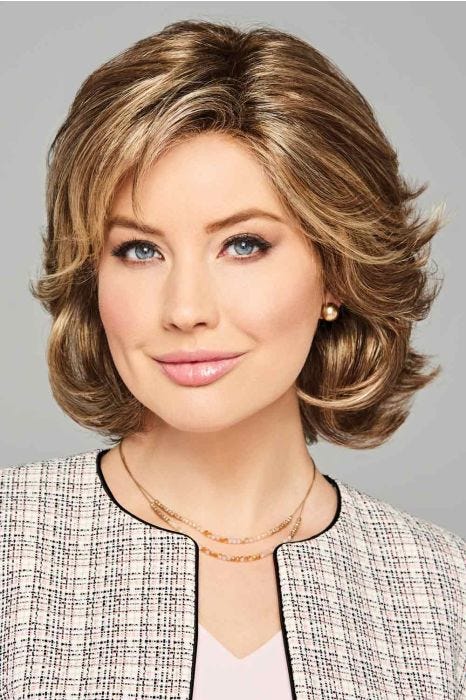 Woman in a chin length layered light brown lace front bob wig with side bangs