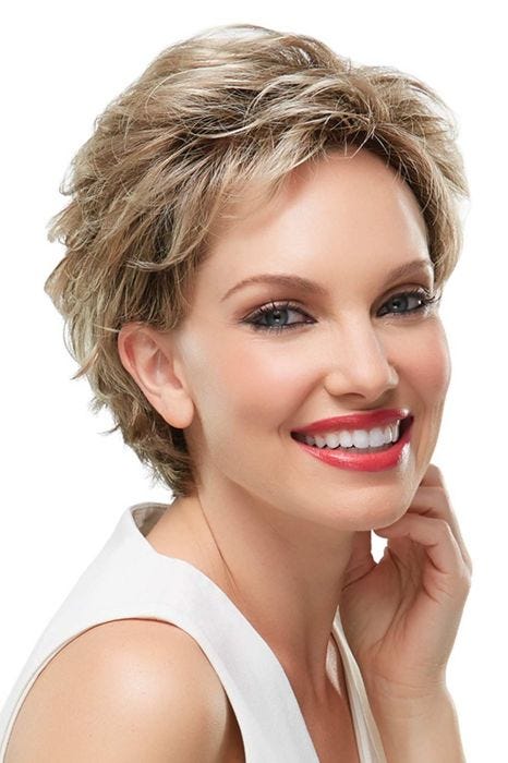 Woman in a classic ash blonde pixie wig with more fullness on top