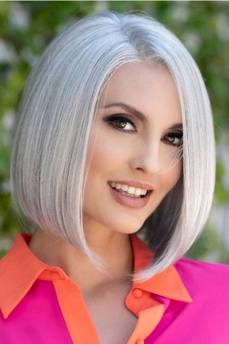 Woman in a shoulder length silver angled lace front bob wig