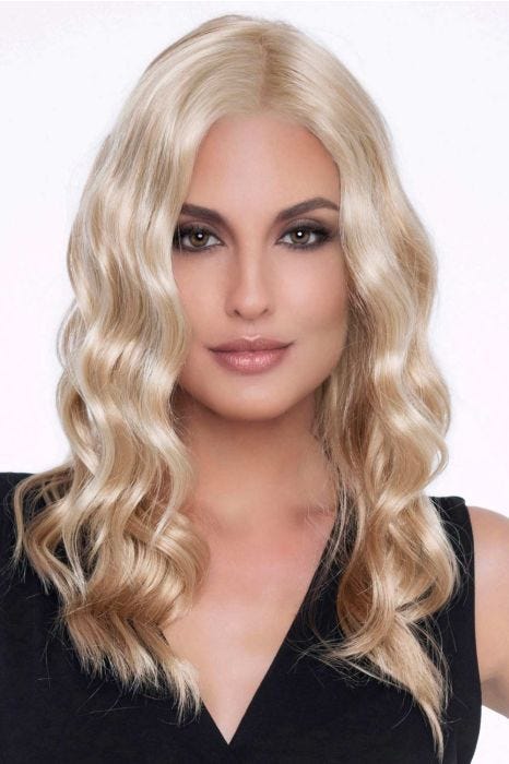 Woman in a past the shoulders wavy light blonde lace front wig