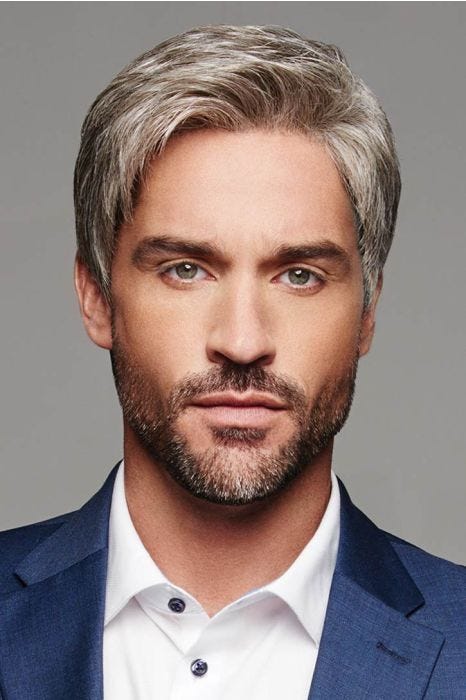 Man in a short evenly cut light brown and grey lace front wig