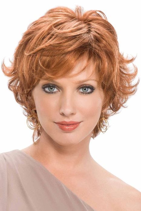 Woman in a short light red wig with flipped out ends and side bangs