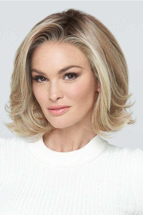 Woman in a chin length layered light blonde lace front bob wig