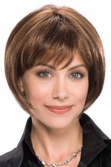 Woman in an ultra petite chin length medium brown rounded bob wig with fringe bangs