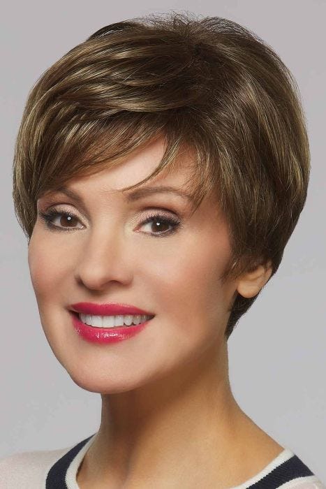 Woman in a dark brown classic pixie wig with fringe bangs
