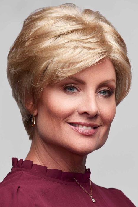 Woman in a long light blonde lace front pixie wig