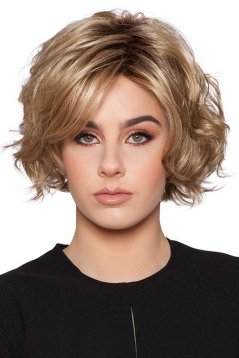 Woman in a chin length curly medium blonde layered bob wig