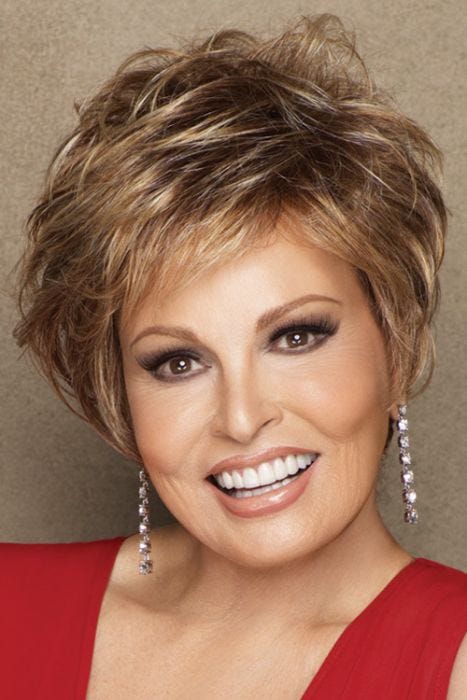 Raquel Welch in short, layered, light auburn bob wig with extra volume in the crown area and textured bangs