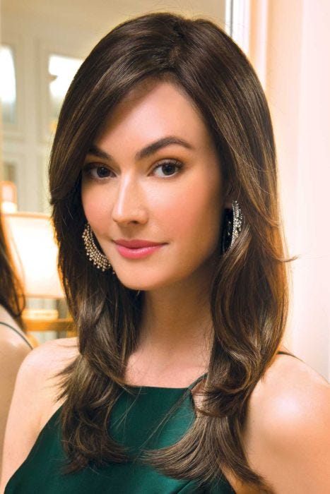 Woman in a long dark brown layered wig