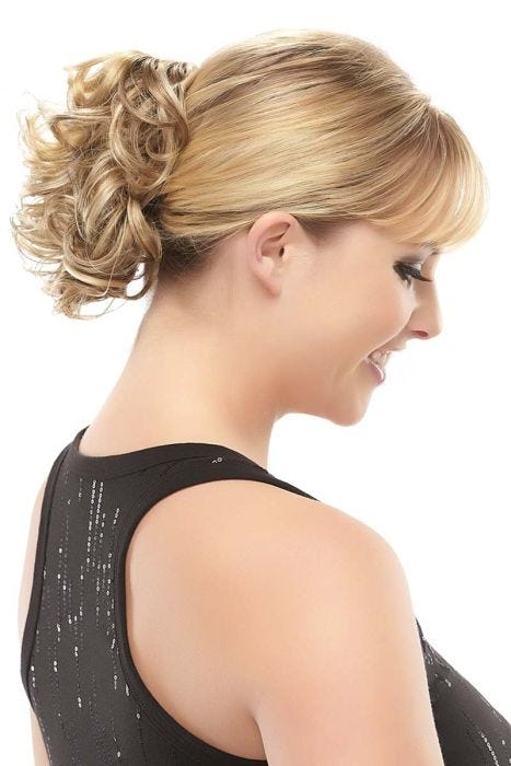 Woman in a 5" light brown curly clip on ponytail