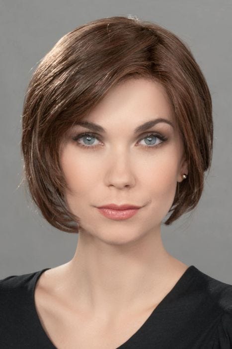 Woman in a chin length dark brown lace front rounded bob wig