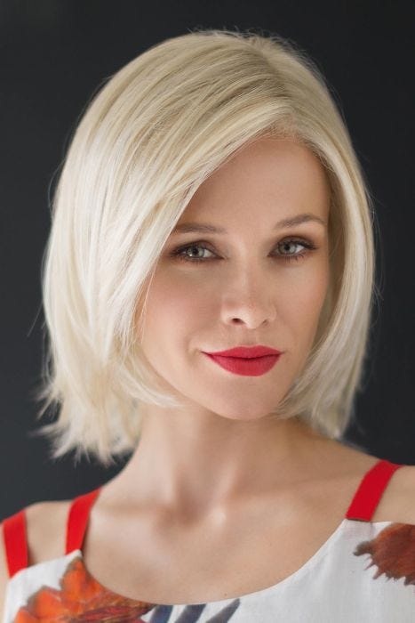 Woman in a shoulder length platinum blonde lace front bob wig