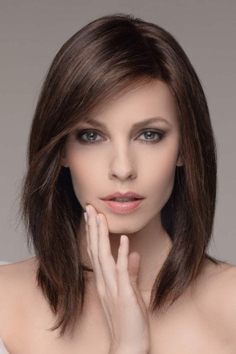 Woman in a past the shoulders dark brown lace front wig with light layering