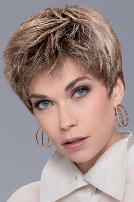 Woman in a classic light auburn lace front pixie wig
