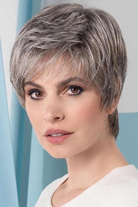 Woman in a cropped medium grey lace front pixie wig