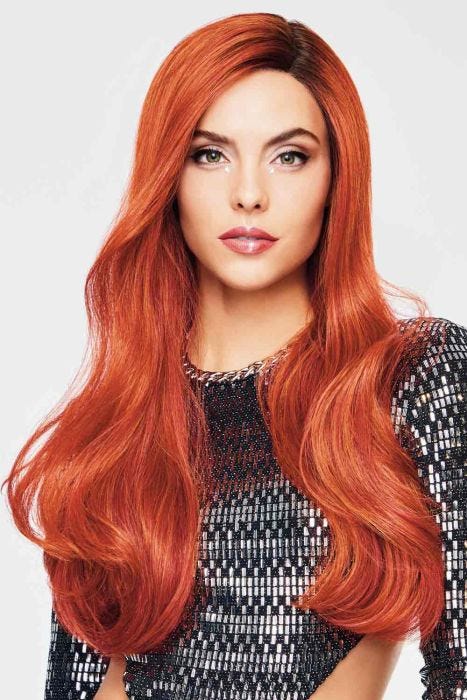 Woman in an extra long red wavy lace front wig