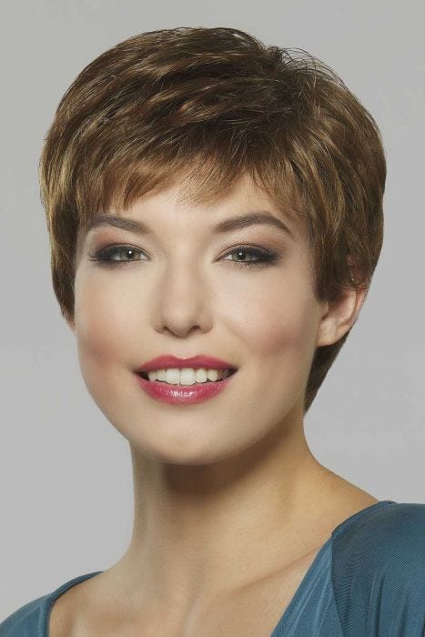 Woman in a short classic light brown pixie wig