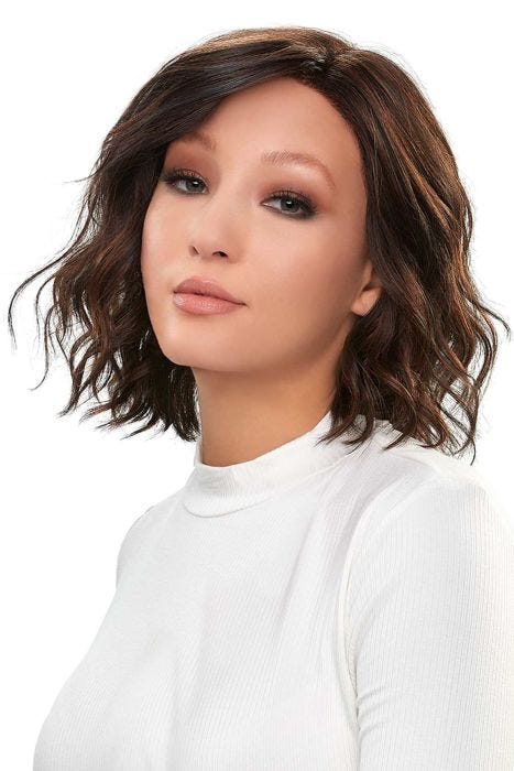 Woman in a petite shoulder length curly dark auburn lace front wig